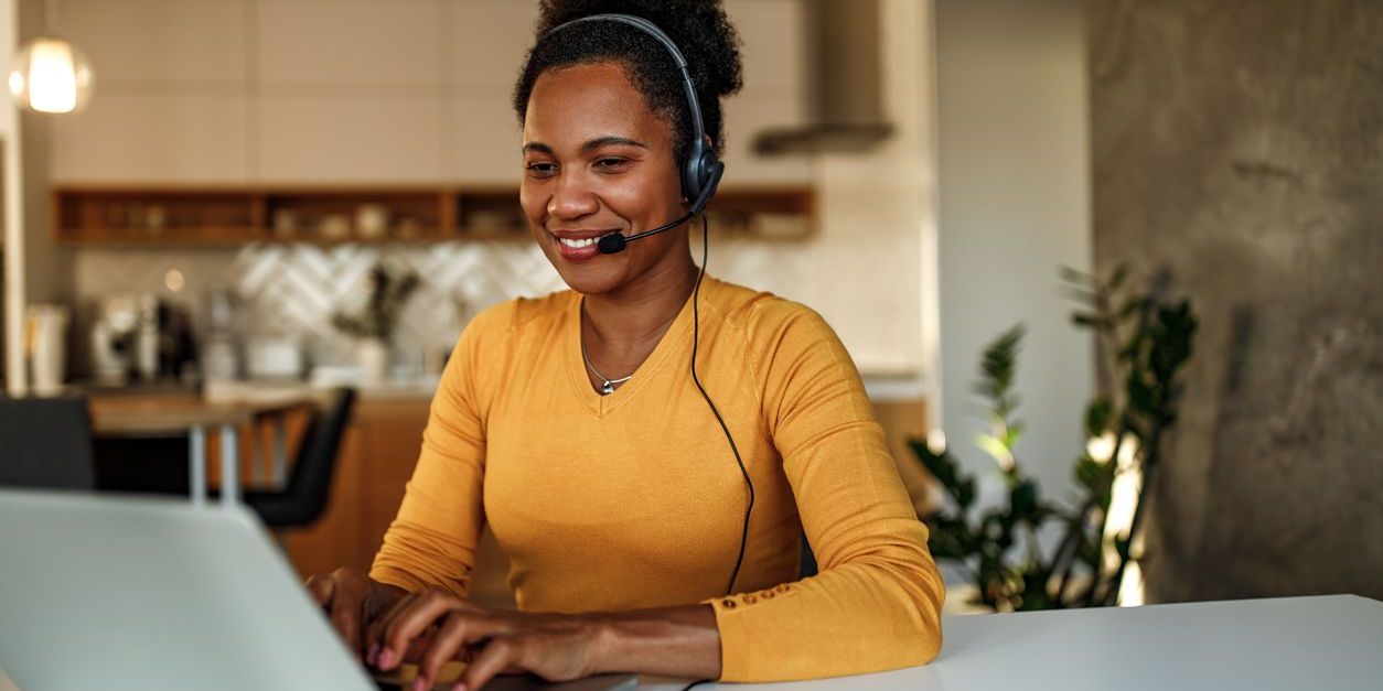 A virtual assistant working on her computer.