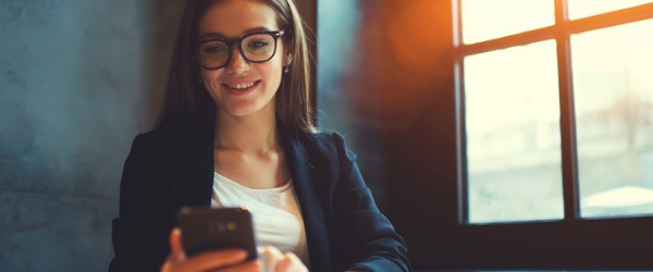 A social media manager on her phone.