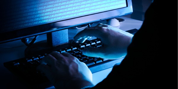 An ethical hacker working on his computer.