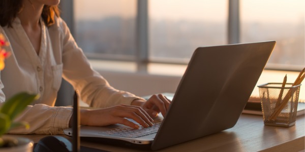 A copywriter working on her computer.